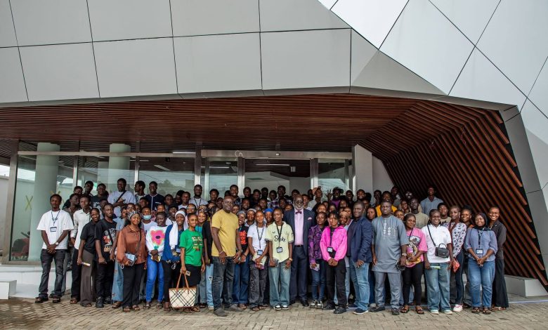 Dayo Adedayo the founder of the DAP Experience Centre with the students with group photograph wit the students