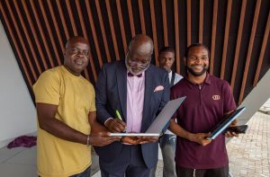 Dayo Adedayo the founder of the DAP Experience Centre signing the autograph