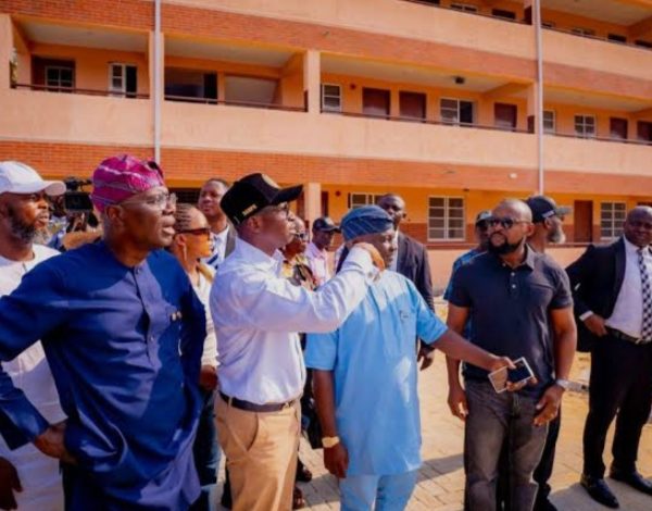 Governor Babajide Sanwo-olu and others taking a tour in Tolu schools