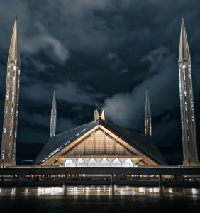 The beautiful Shah Faisal Mosque illuminating under the night sky- Islamabad,Pakistan.