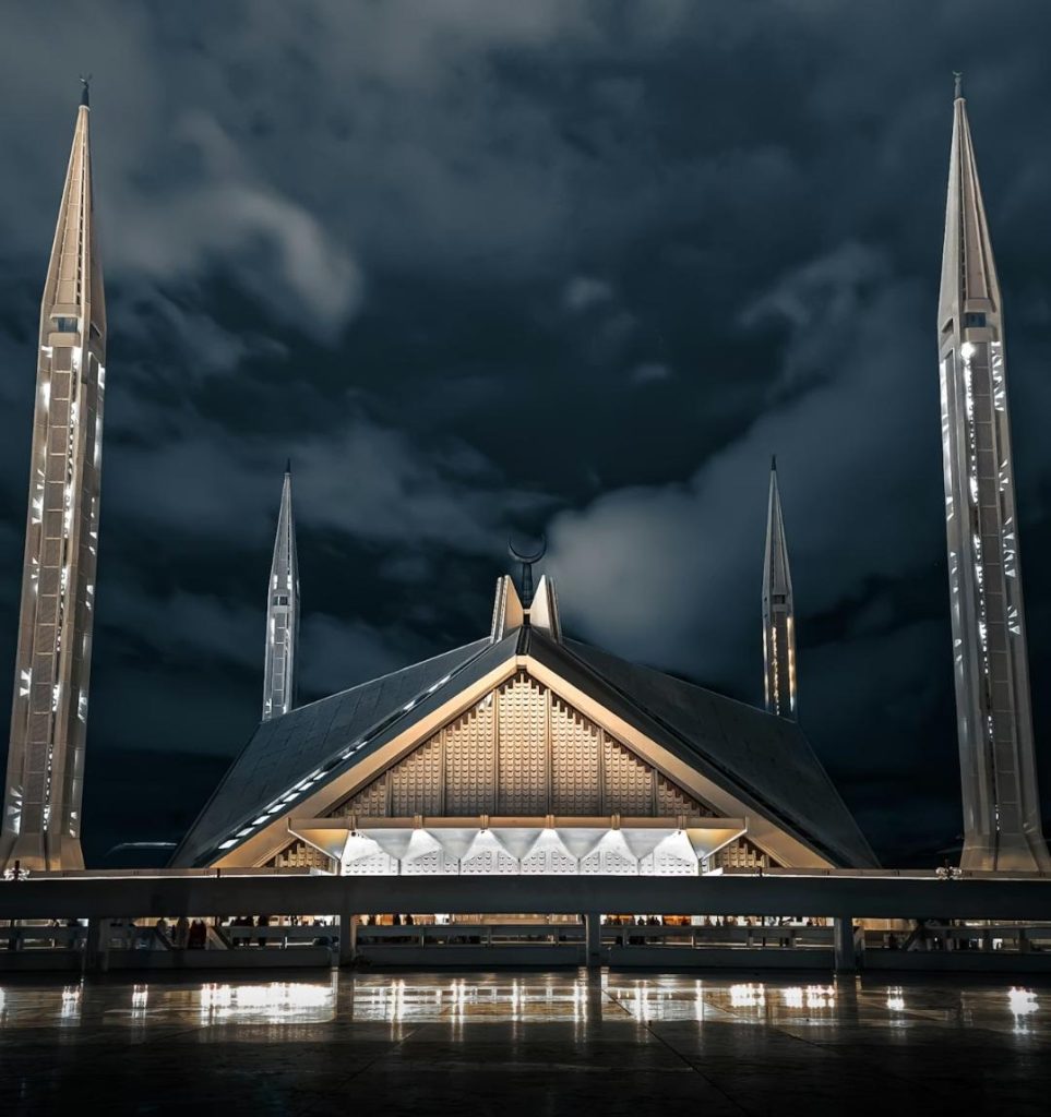 The beautiful Shah Faisal Mosque illuminating under the night sky- Islamabad,Pakistan.