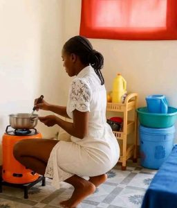 Lady cooking on gas