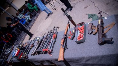 Police displaying weapons