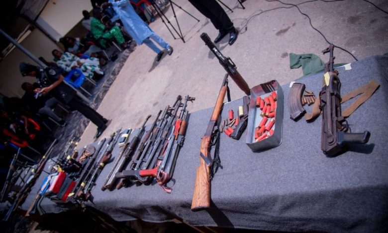 Police displaying weapons