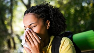 Generated image of Person sneezing outdoors
