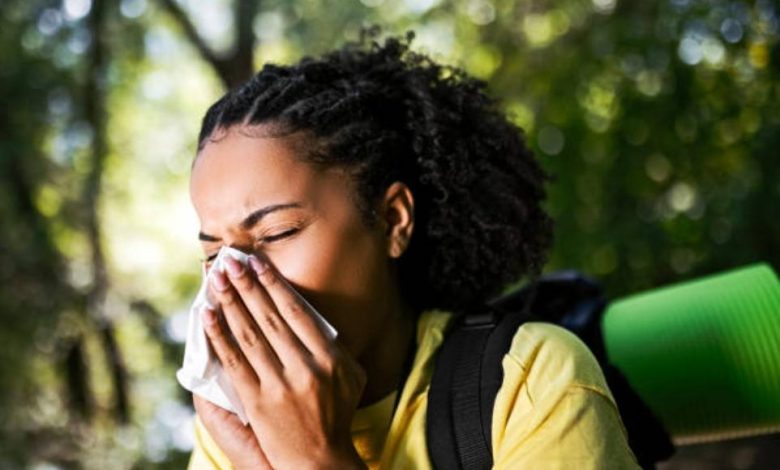 Generated image of Person sneezing outdoors