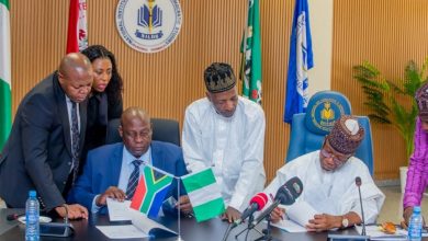 A diplomatic meeting between Nigerian and South African officials.