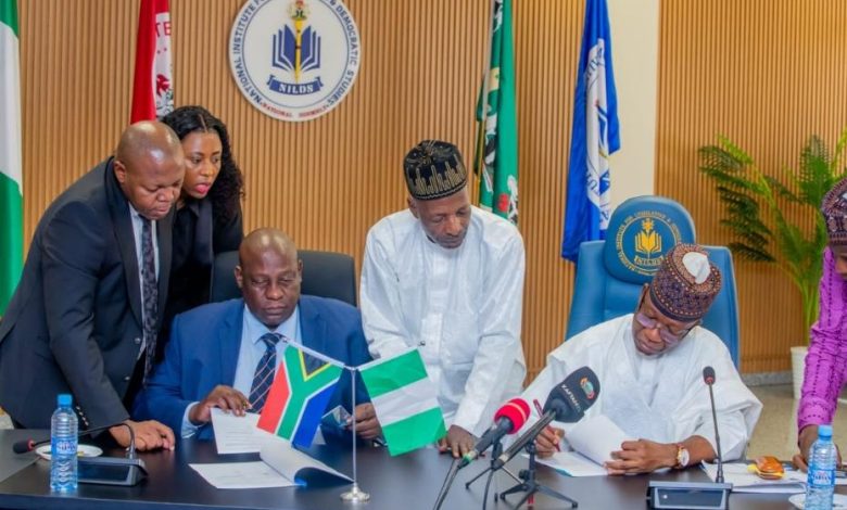 A diplomatic meeting between Nigerian and South African officials.