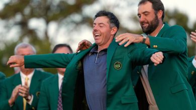 Scottie Scheffler puts the green Jacket on winner, Rory McIlroy, of Northern Ireland, at the Masters golf tournament, April 13, 2025, in Augusta, Ga. (AP Photo/Ashley Landis, File)4